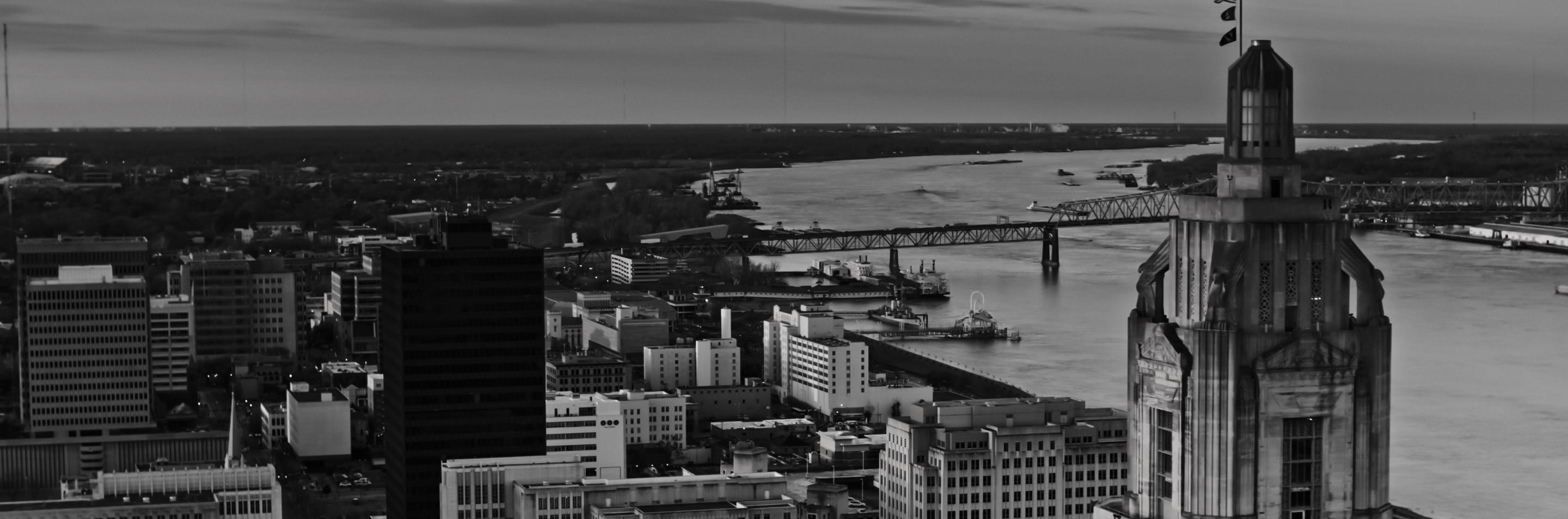 View overlooking downtown city in Louisiana, with a river winding alongside.